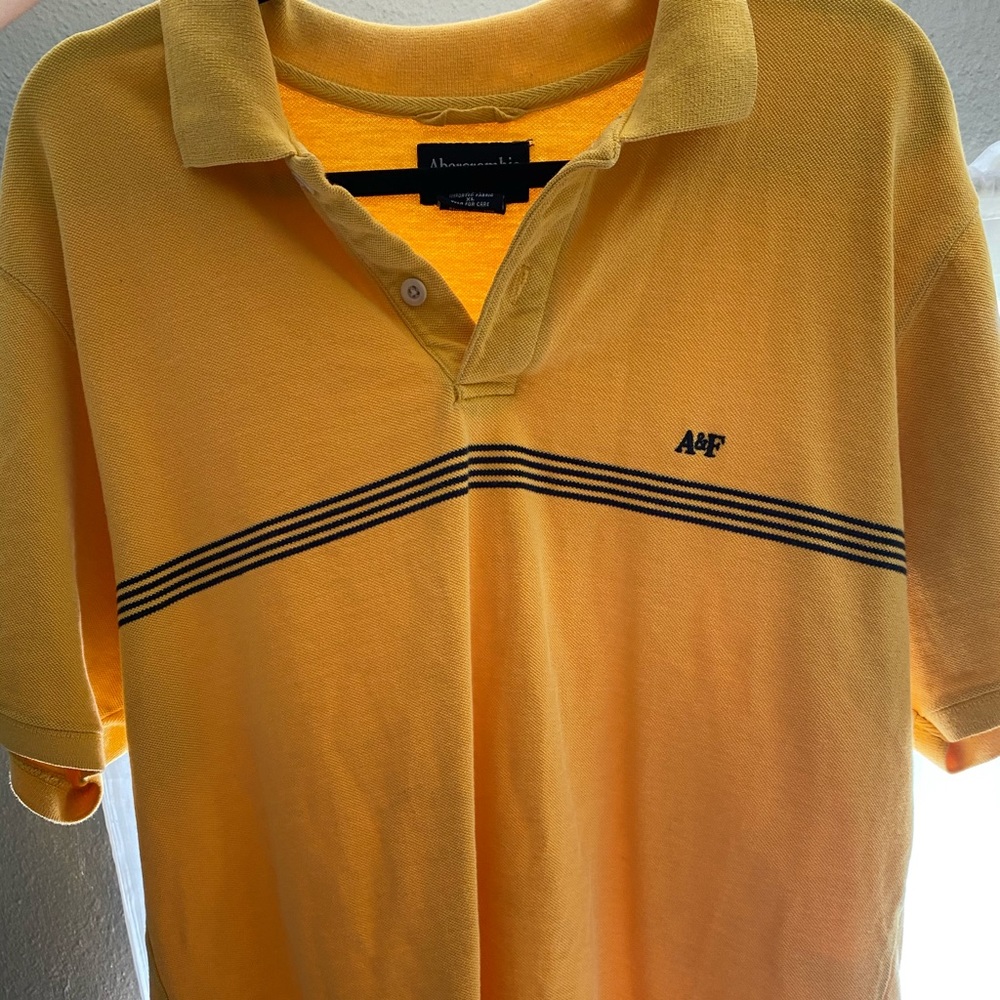 Abercrombie and Fitch yellow shirt. :)